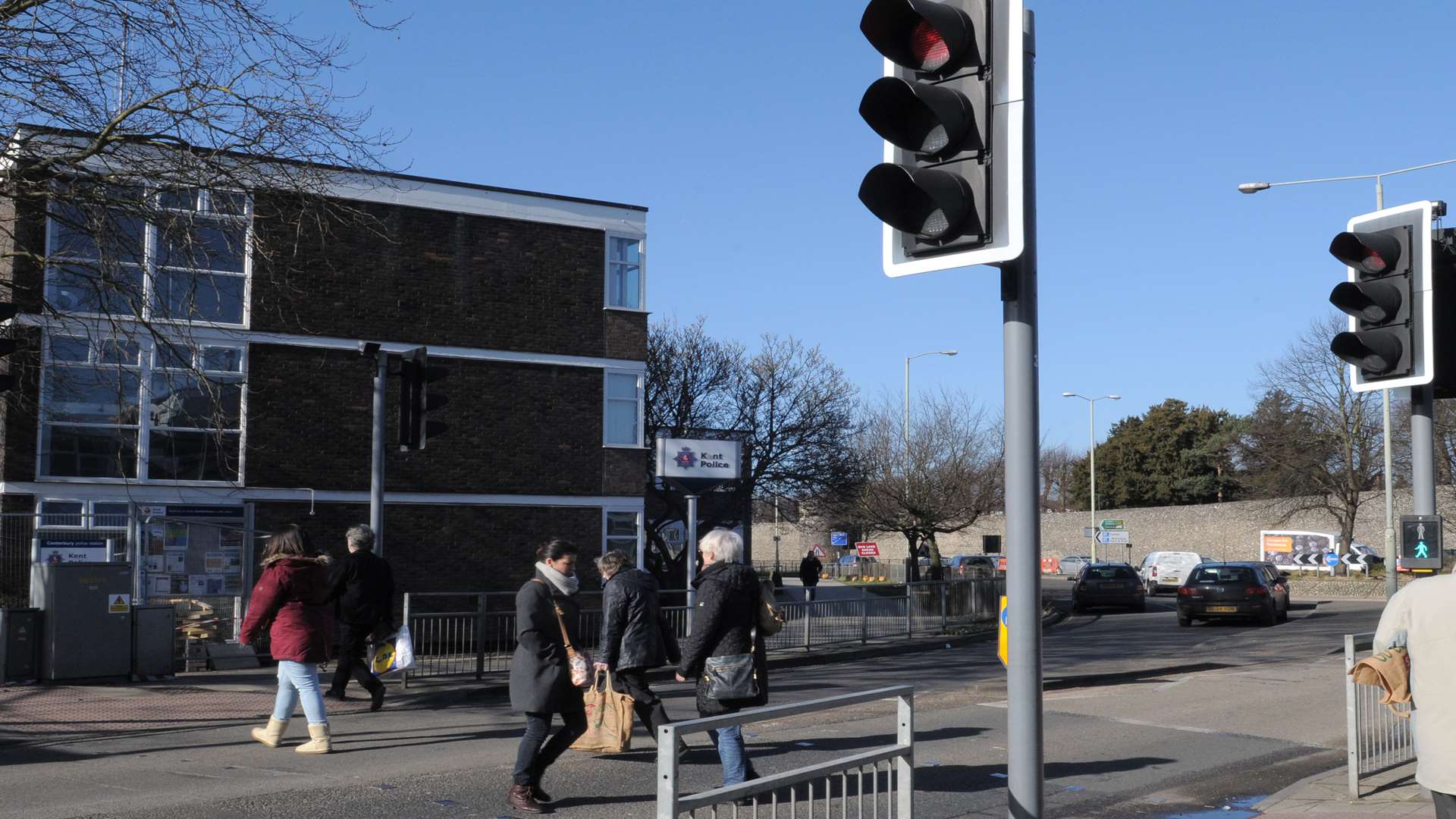 Woman hit on pedestrian crossing outside police station