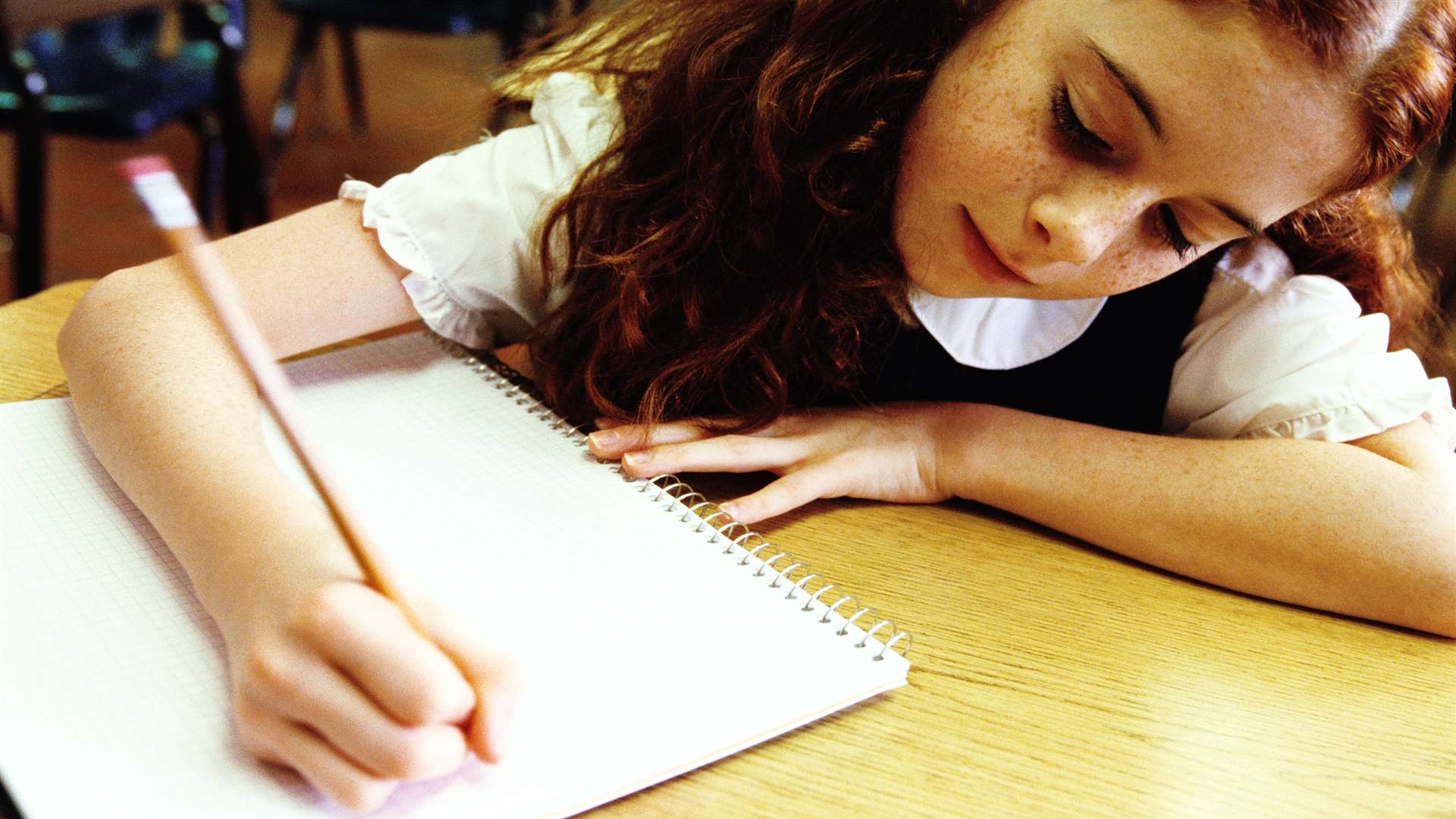 Girl sitting exam. Stock image.