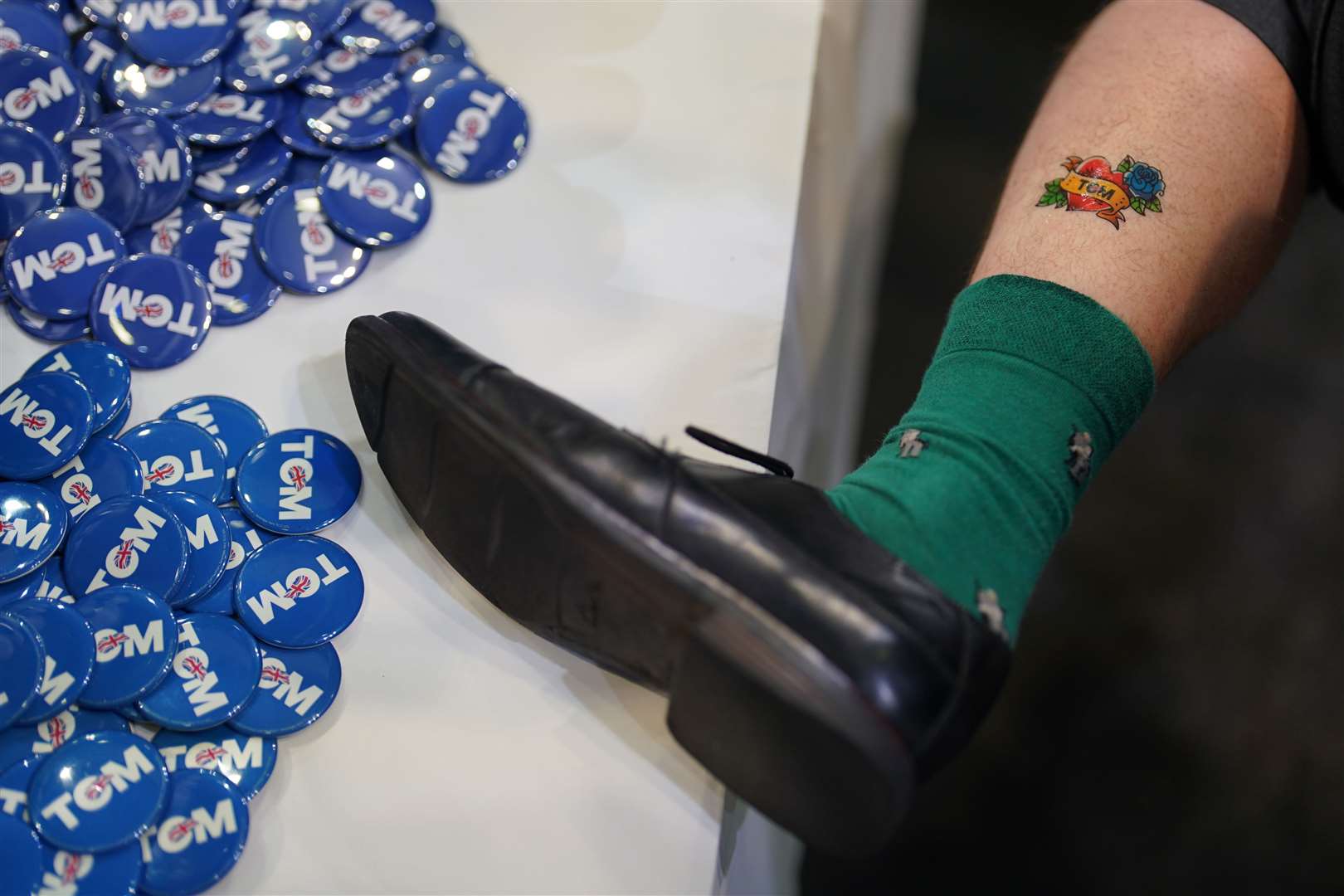 Tom Tugendhat’s campaign merchandise includes Tugend-tan fake tan, the Daily Tugendchat newsletter and Tugent-tat temporary tattoos (pictured) (Jacob King/PA)