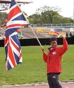 STANDARD BEARER: Candy Hawkins carries the flag at the opening ceremony in Melbourne. Picture: MARSHALL THOMAS