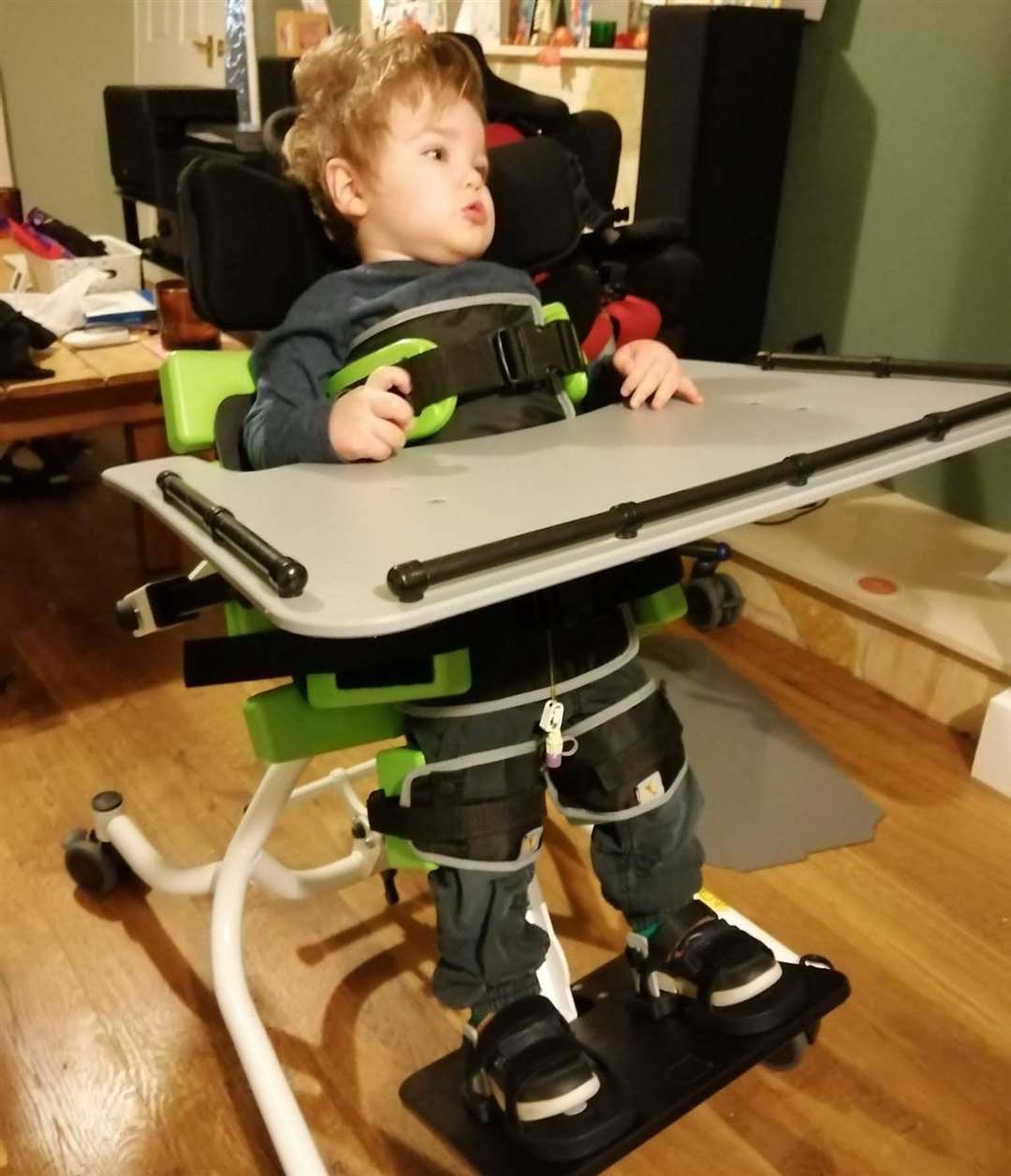 Kit now needs support to walk and cannot hold up his head on his own