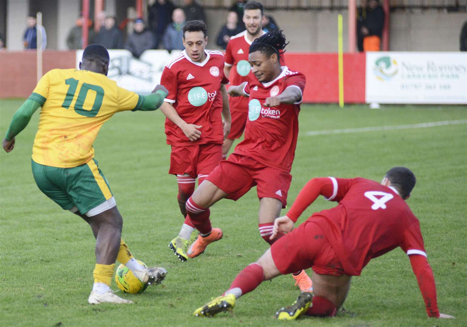 Hythe's Stephen Okoh puts in a challenge in against Ashford on Saturday Picture: Paul Amos