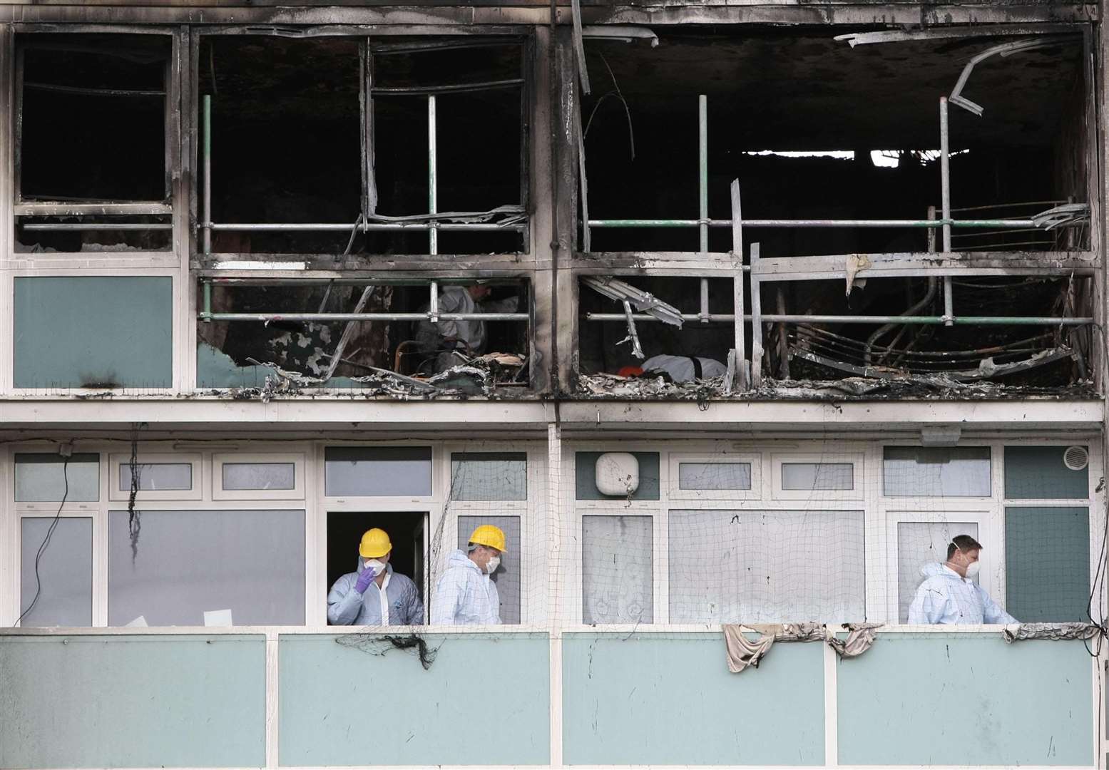 Forensic officers inspect the scene of the fire in Lakanal House in Camberwell, south London, in July 2009 (Carl Court/PA)