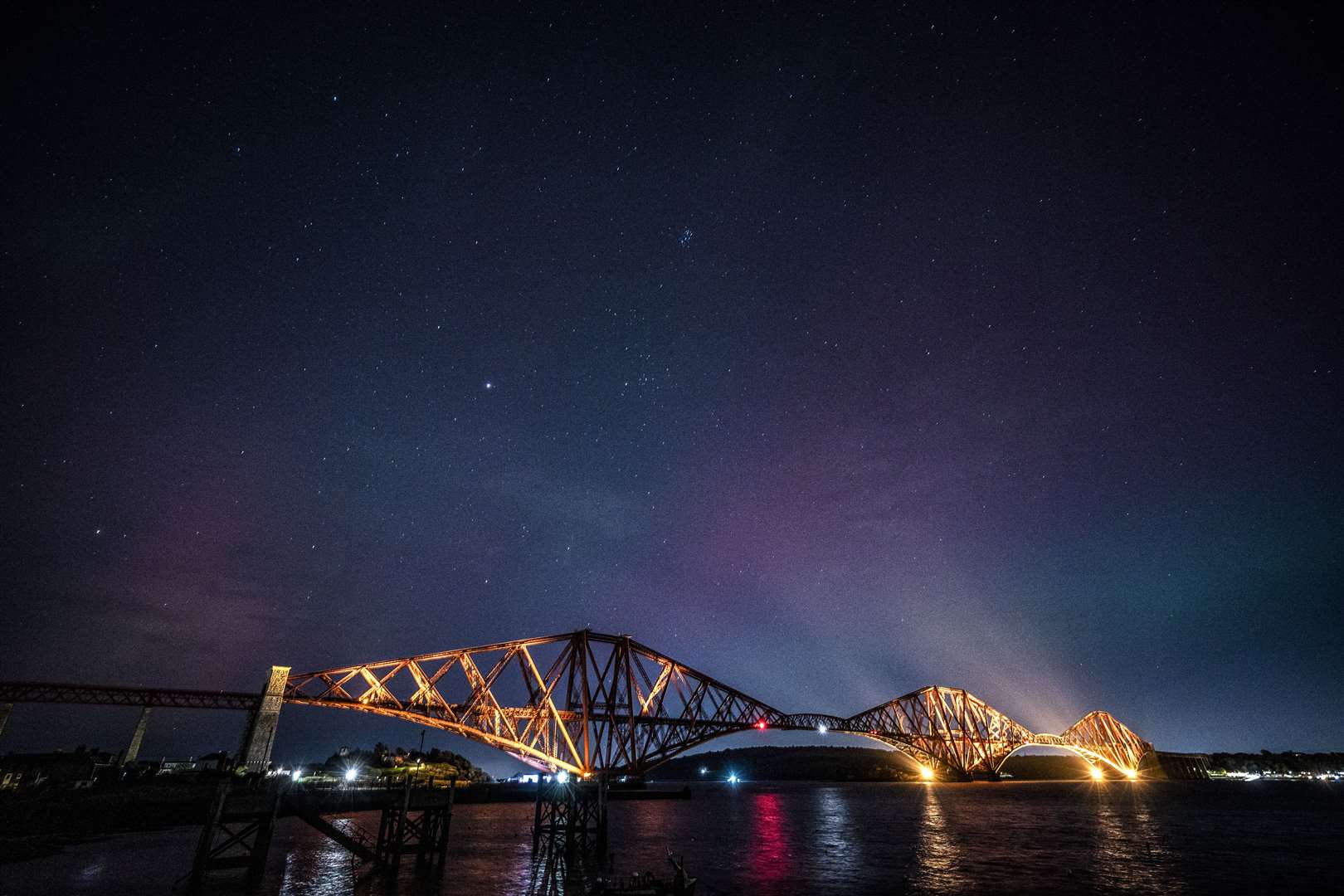 The Northern Lights, also known as the aurora borealis, were visible above the Forth Bridge in October (Jane Barlow/PA)