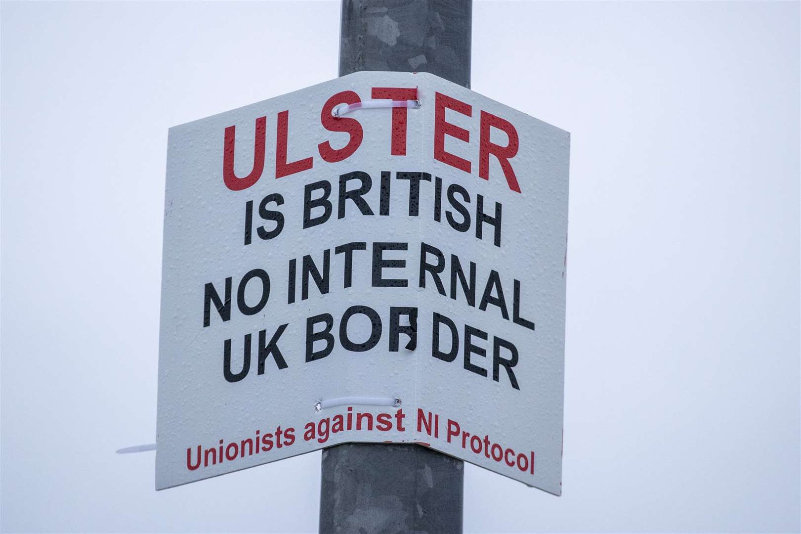 A sign on a lamppost near Larne Port (Liam McBurney/PA)