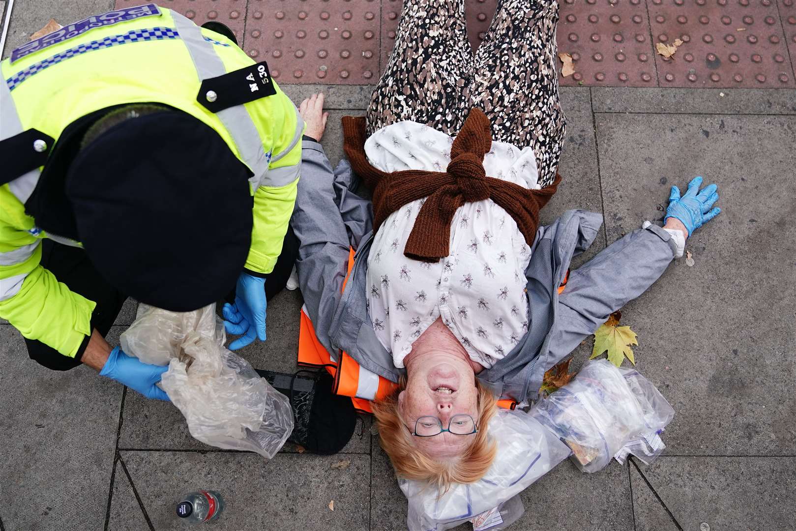 Police remove activists from Just Stop Oil during their protest on Cromwell Road near the Victoria & Albert Museum (Aaron Chown/PA)