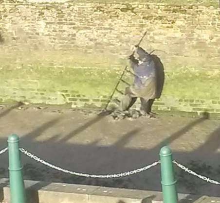 Man stuck in the mud in Faversham creek. Picture: Bryony Coe