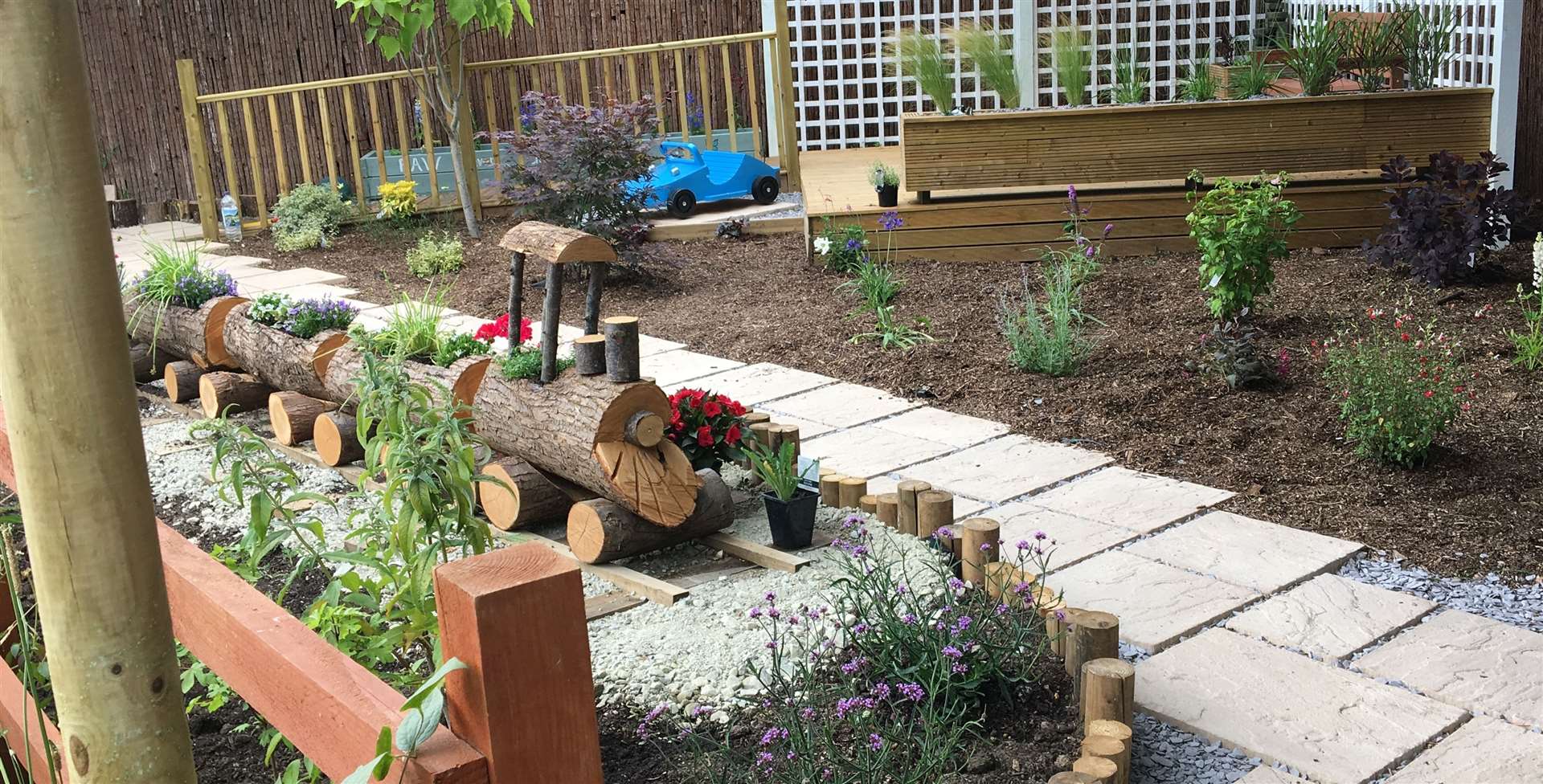 The flower bed which resembles a train, made by Anthony Diprose in the grounds of Five Acre Wood School