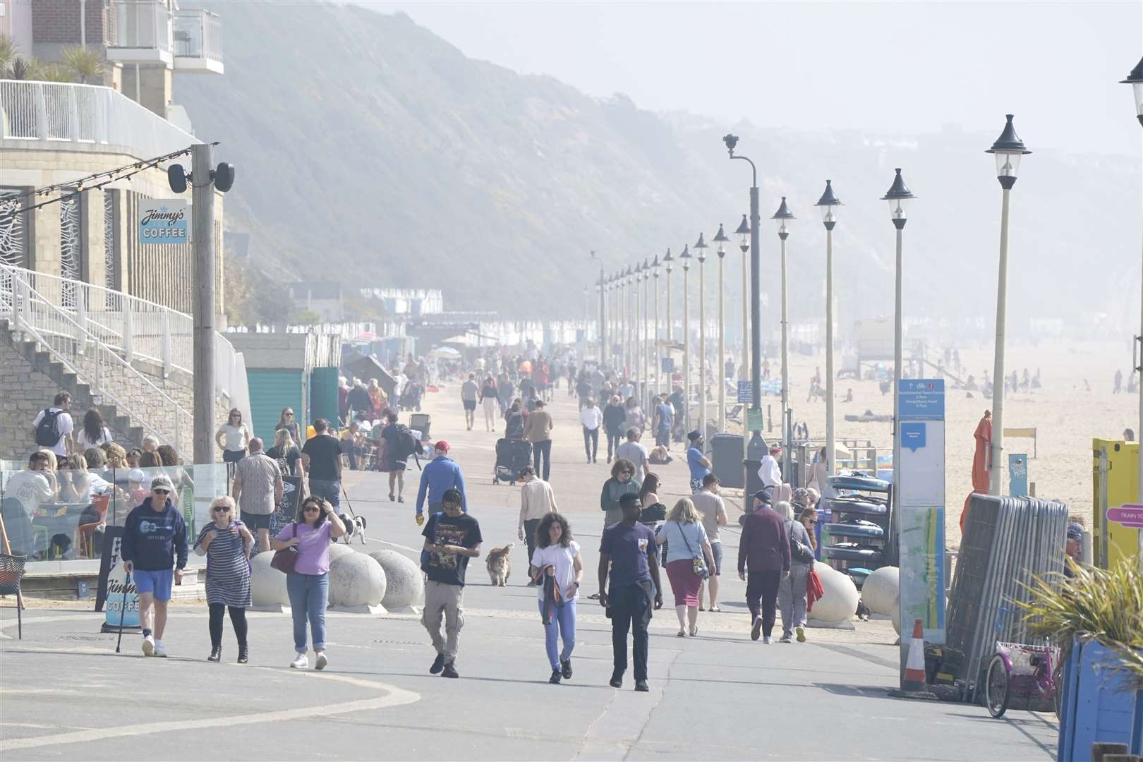 People enjoy the good weather at Boscombe beach in Dorset (Andrew Matthews/PA)