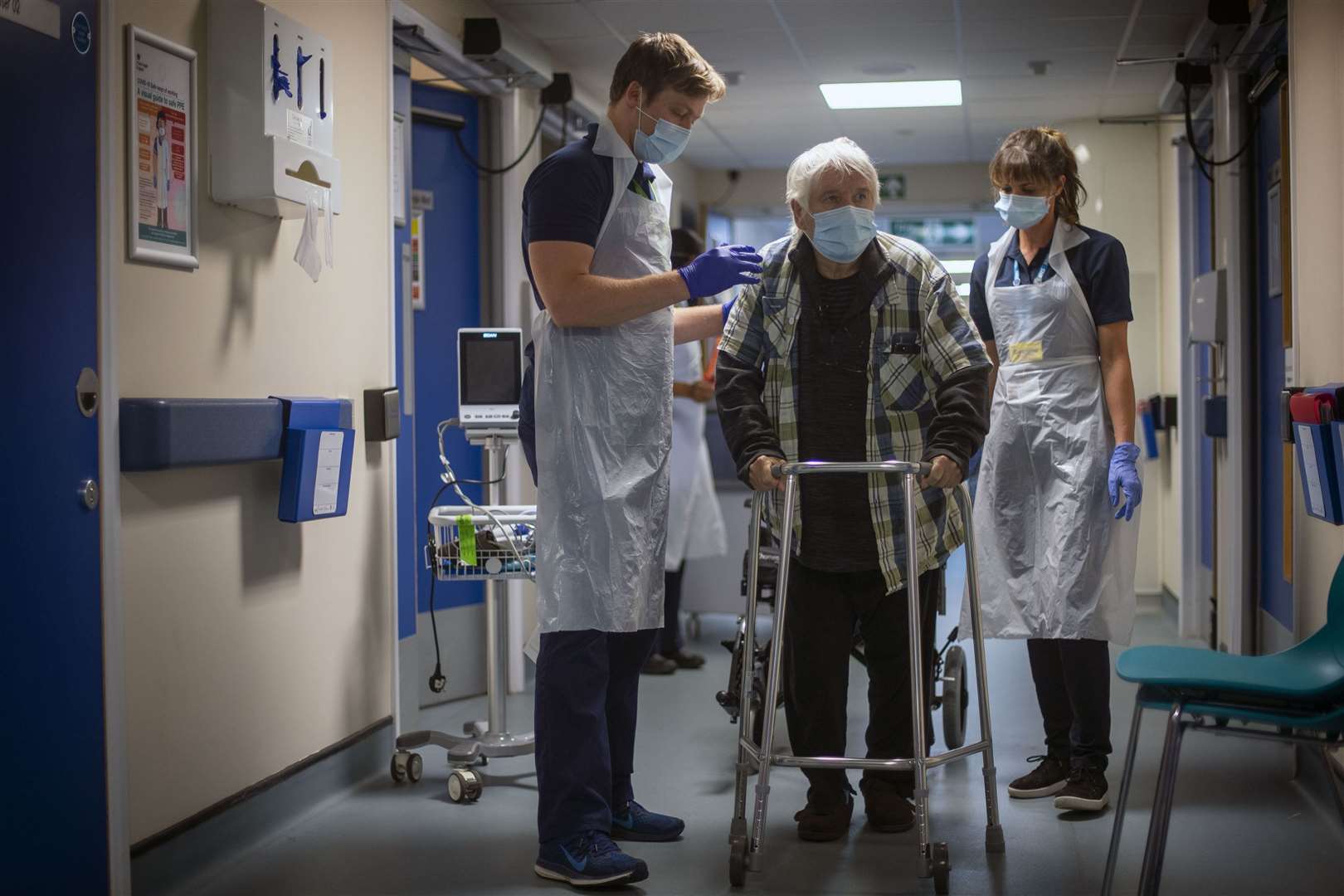 Rehab Support workers perform a physiotherapy treatment on patient Michael Kidd, 82, who was one of the first patients admitted to the NHS Seacole Centre at Headley Court, Surrey (Victoria Jones/PA)