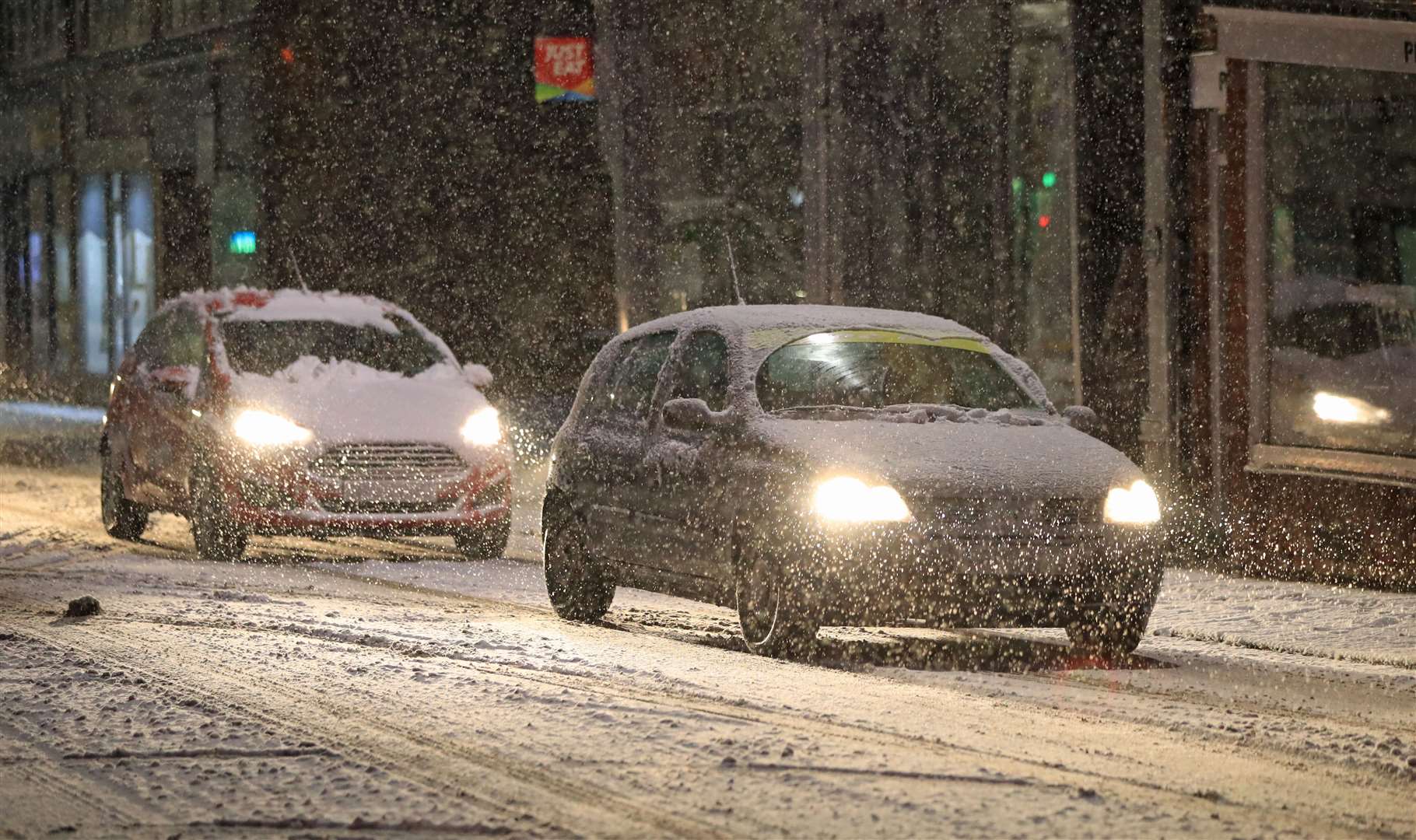 Motorists drive through the streets of Knaresborough in North Yorkshire after snow fell overnight (Danny Lawson/PA)