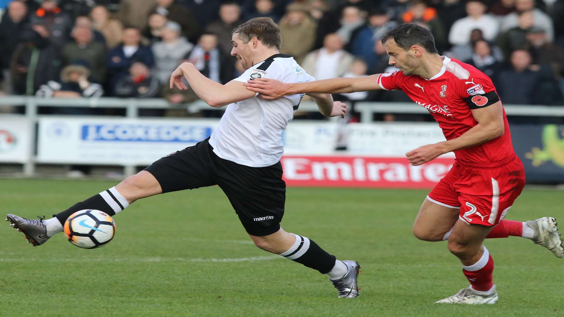 Tom Murphy under pressure against Swindon Picture: Andy Jones