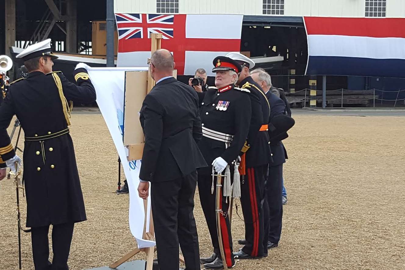 The unveiling of the anniversary plaque