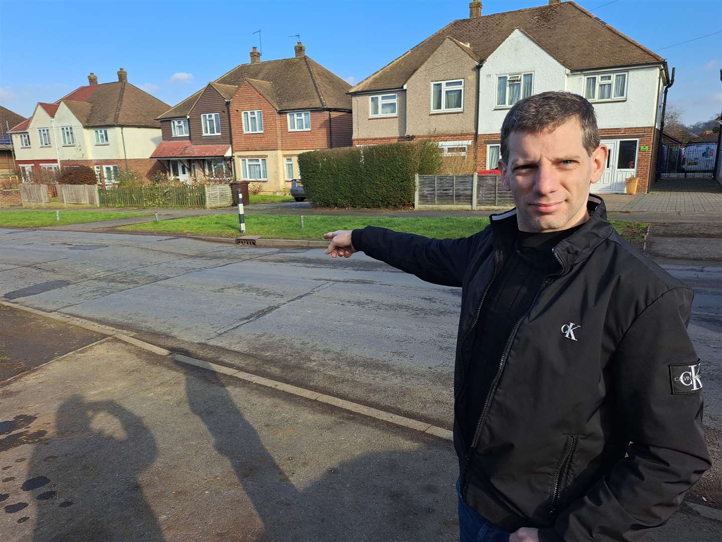 Shane Tiplady points out one of the pothole repairs