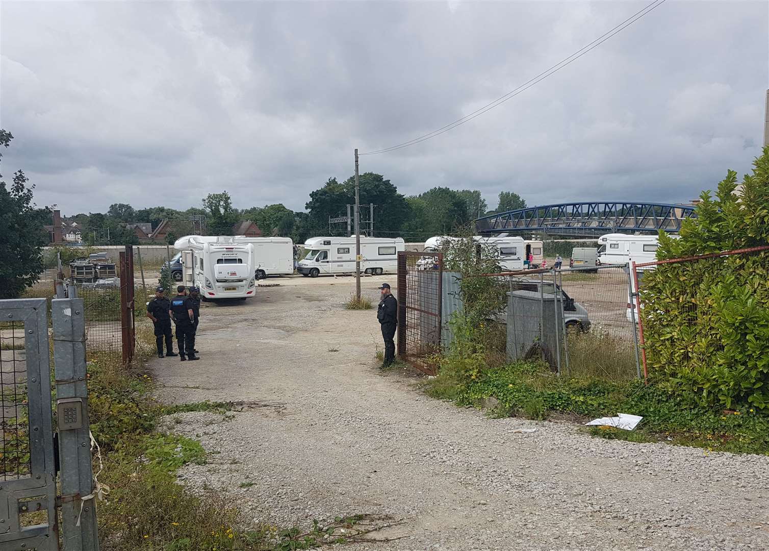 Bailiffs stationed at the entrance to the traveller camp