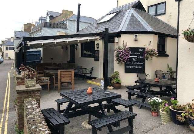 Pictured in the daylight, this is the outdoor seating area at the back of the Royal Norfolk Hotel