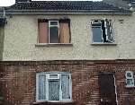 The scarred house after the fire had been put out