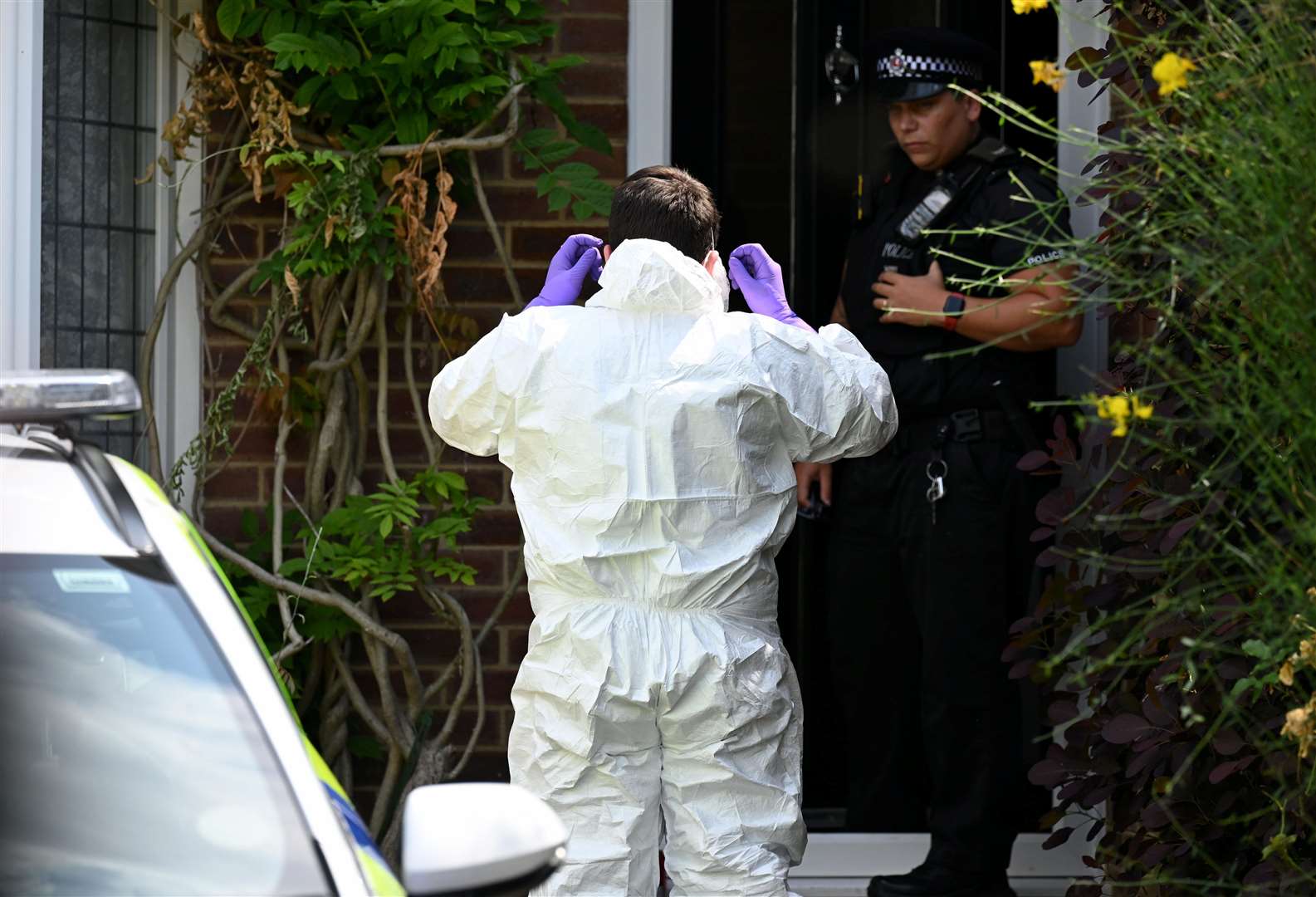 Forensics pictured in Mooring Road, Rochester, where a motorbike believed to be connected to the stabbing was found last night. Picture SWNS