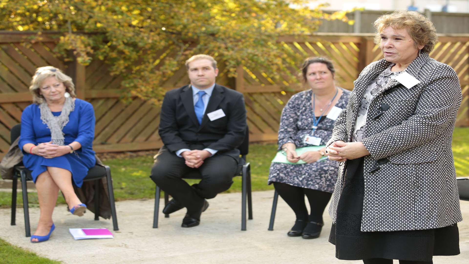 Fay Maxted from The Survivors' Trust, talks about Beech House, watched by Ann Barnes, Gary Green from Mountain Healthcare, and Vanessa Fowler from NHS England