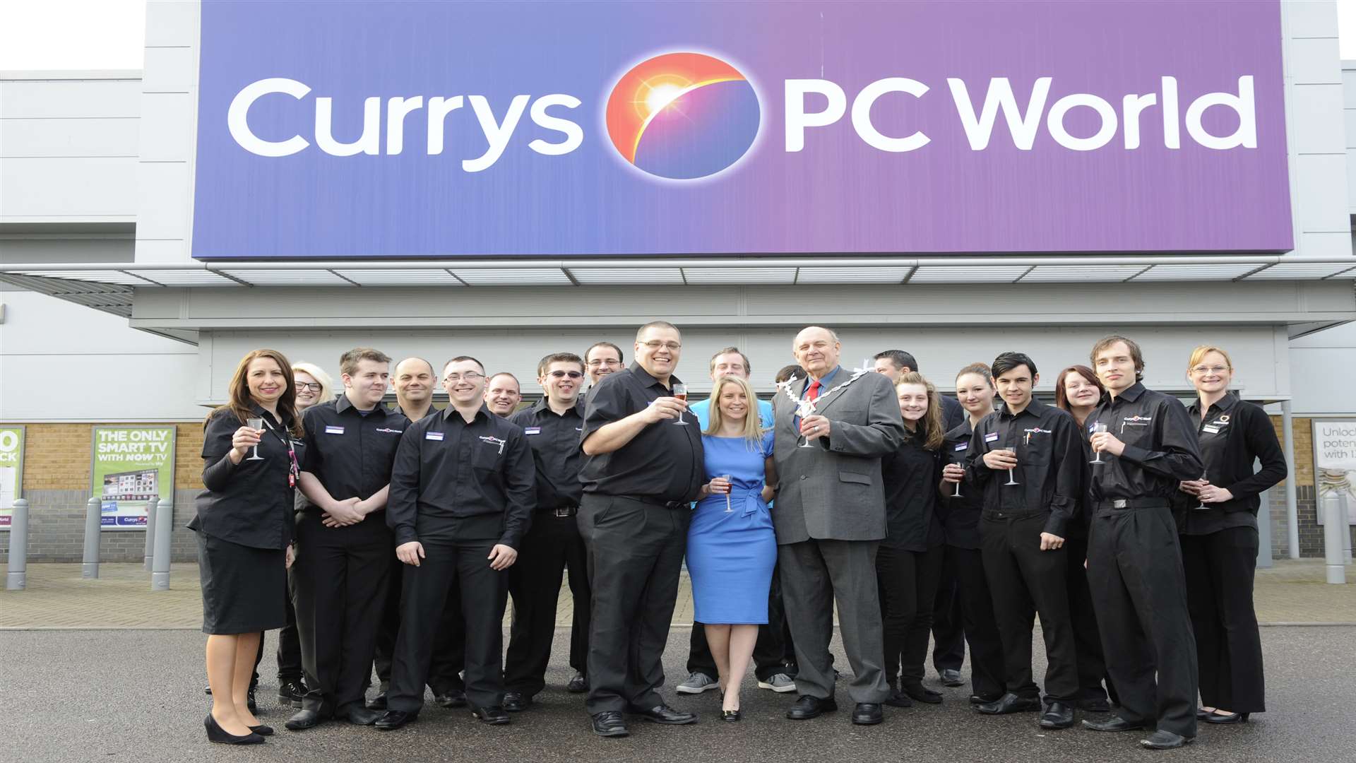 Staff at the reopening of the Currys PC World store at the Gallagher Retail Park in Norman Road