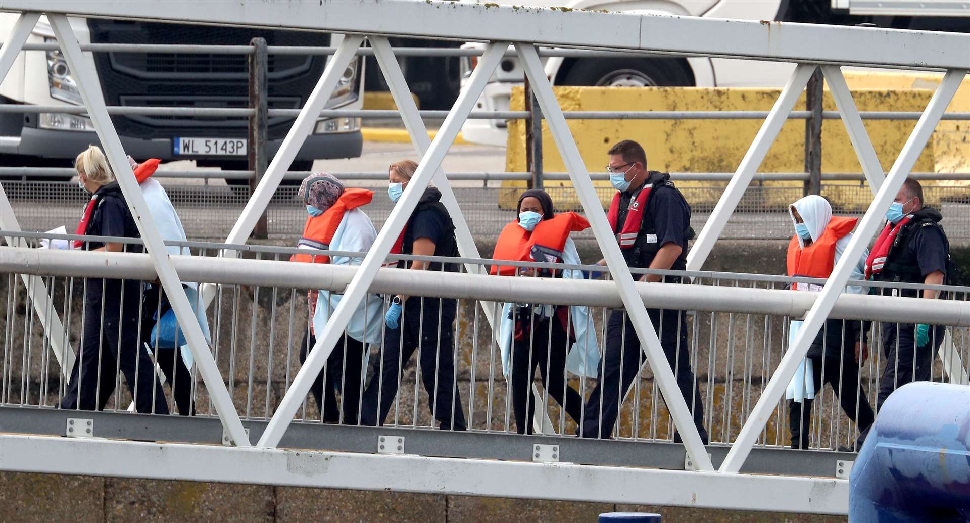 A group of people thought to be migrants are brought into Dover, Kent (Gareth Fuller/PA)