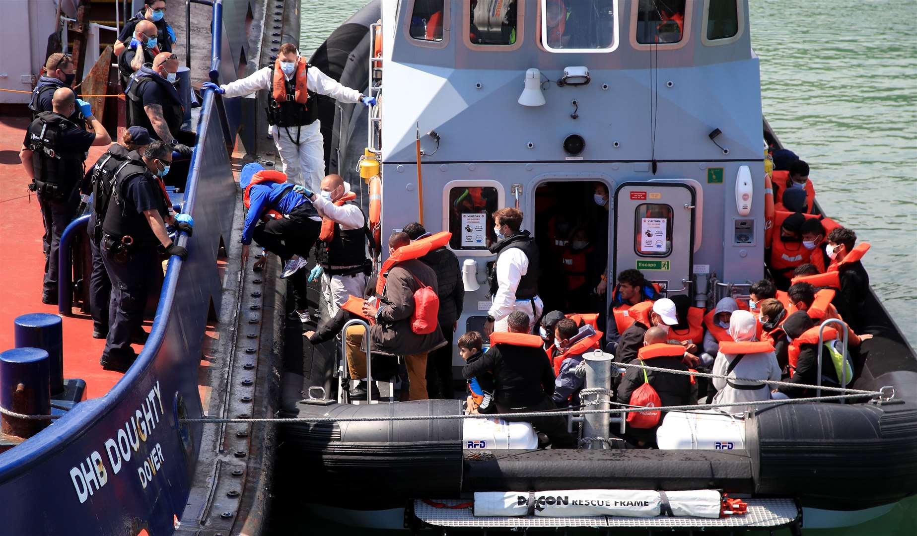 A group of people thought to be migrants are brought in to Dover, Kent, following a small boat incident in the Channel (Gareth Fuller/PA)