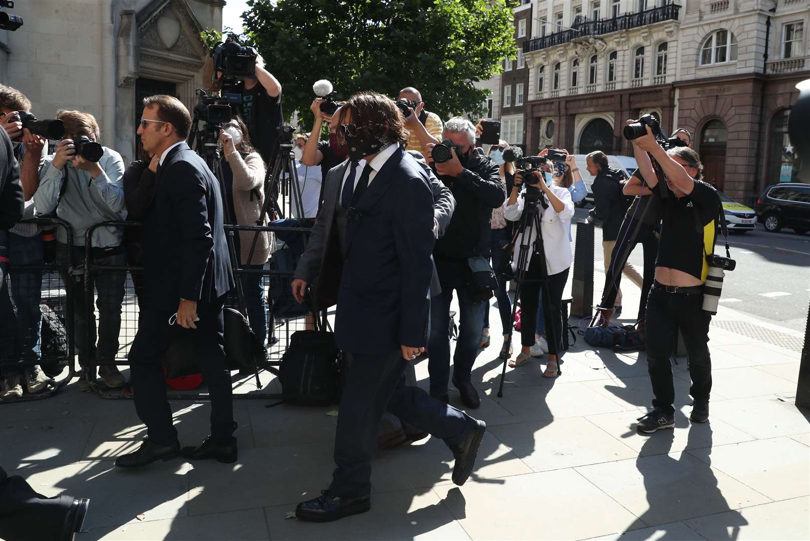 Johnny Depp, centre, arriving at court (Steve Parsons/PA)