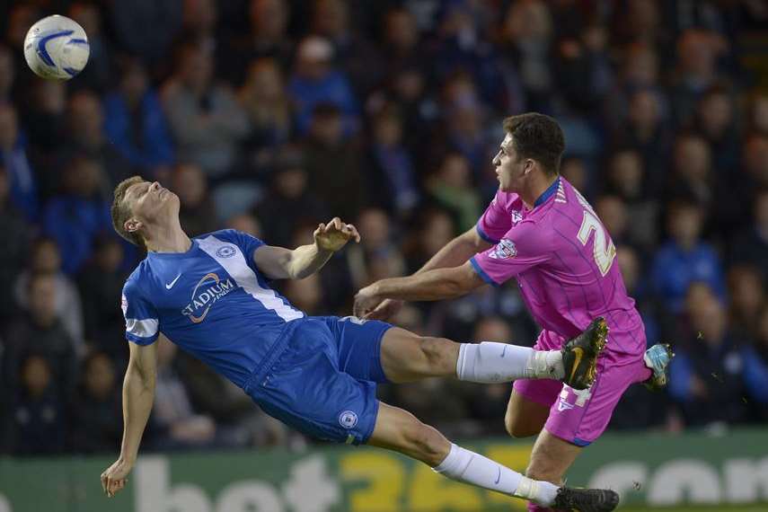 Ryan Inniss gets stuck in as Gills battle for the points at London Road Picture: Ady Kerry