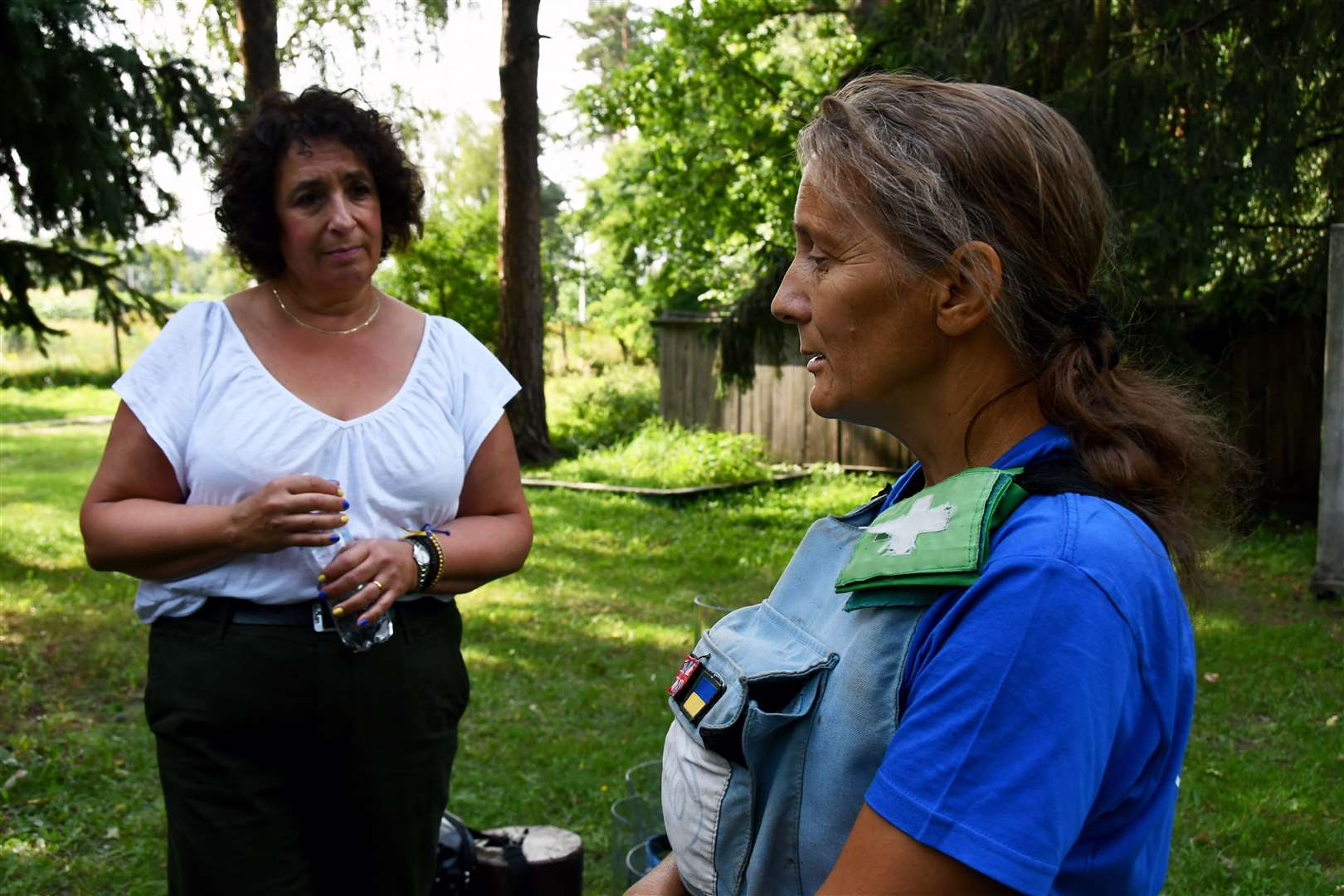 UK ambassador Melinda Simmons, right, listens to the experiences of mine clearance expert Tetyana Fedyuk (The Halo Trust/PA)