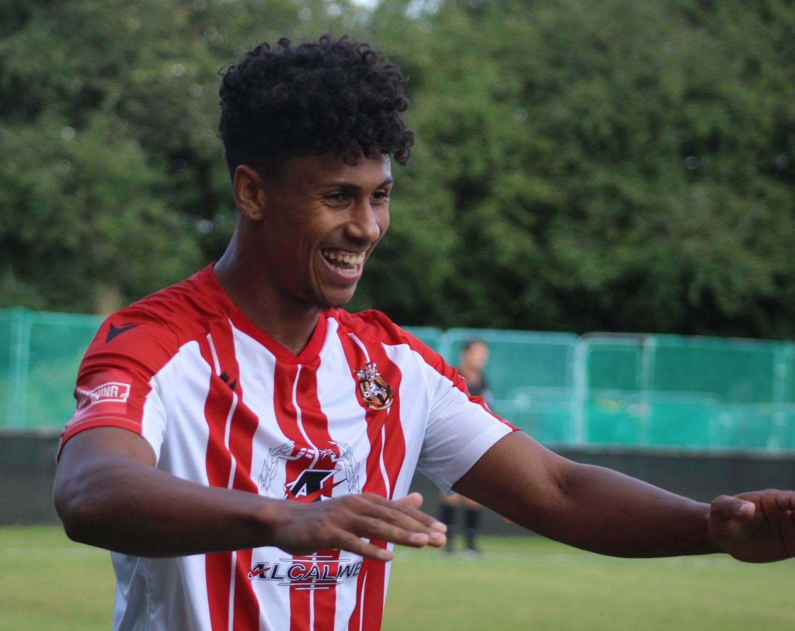 Folkestone Invicta winger Jordan Ababio celebrates one of his two goals in the FA Cup win at Hartley Wintney. Picture: FIFC