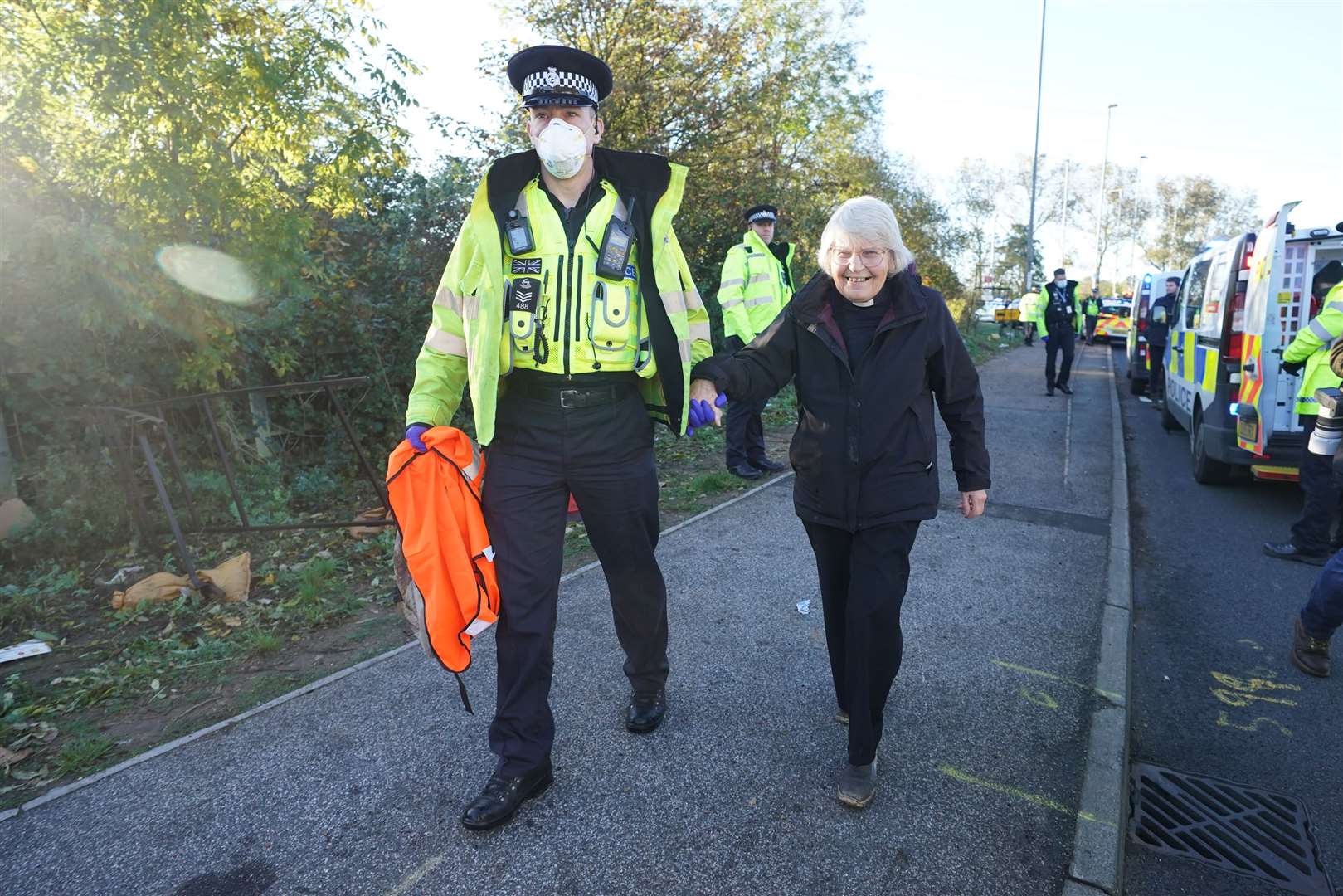 Reverend Sue Parfitt is led away by police (Ian West/PA)