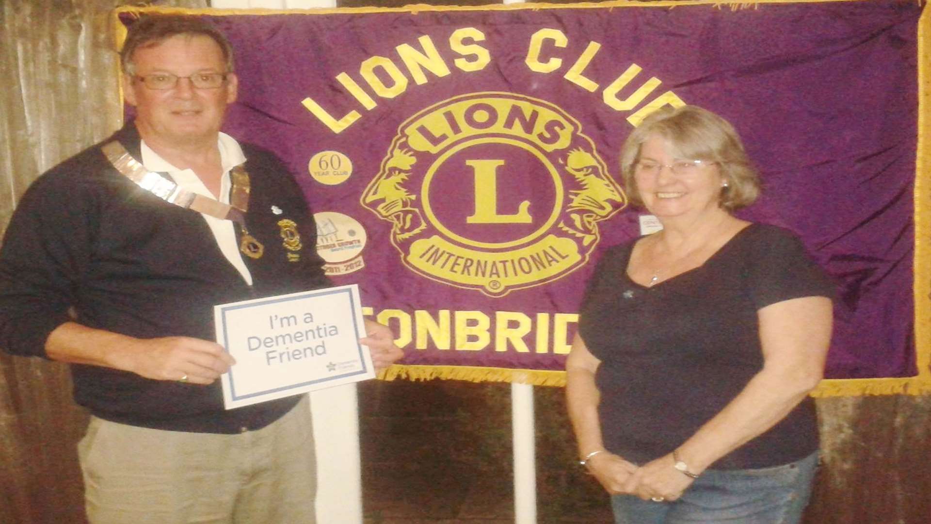 James Lark, President of the Tonbridge Lions Club, with Christine Parker, Managing Director of Abbey Funeral Services in Tonbridge