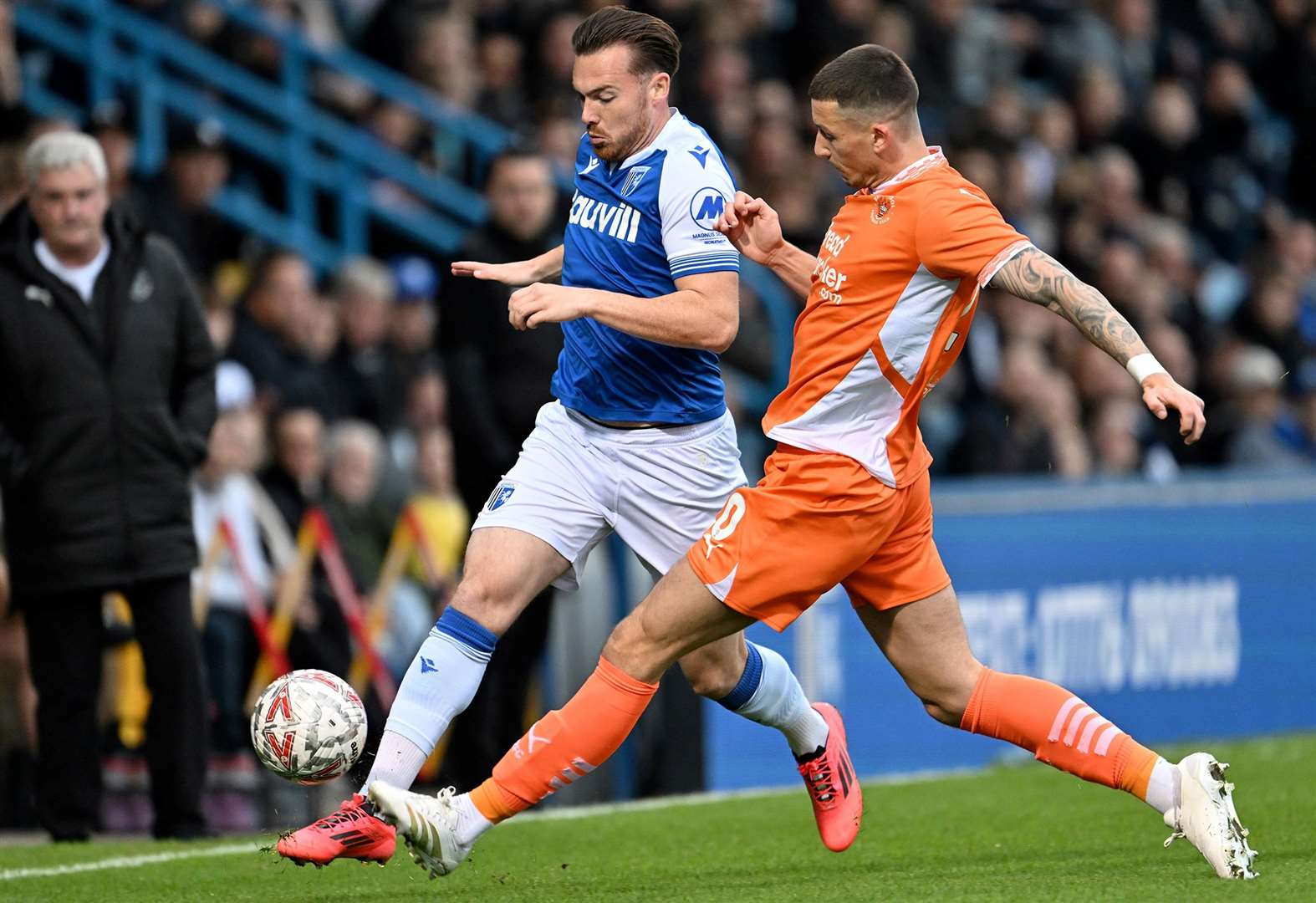 Jack Nolan looks to drive Gillingham forward against Blackpool on Saturday. Picture: Keith Gillard