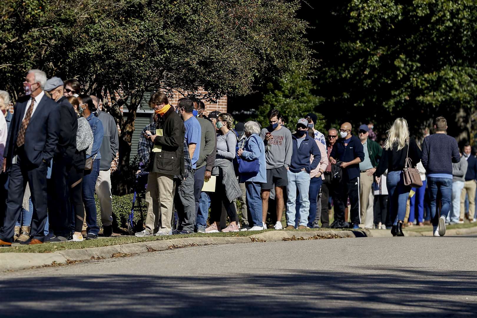 Long queues form to vote in Auburn, Alabama (Butch Dill/AP)