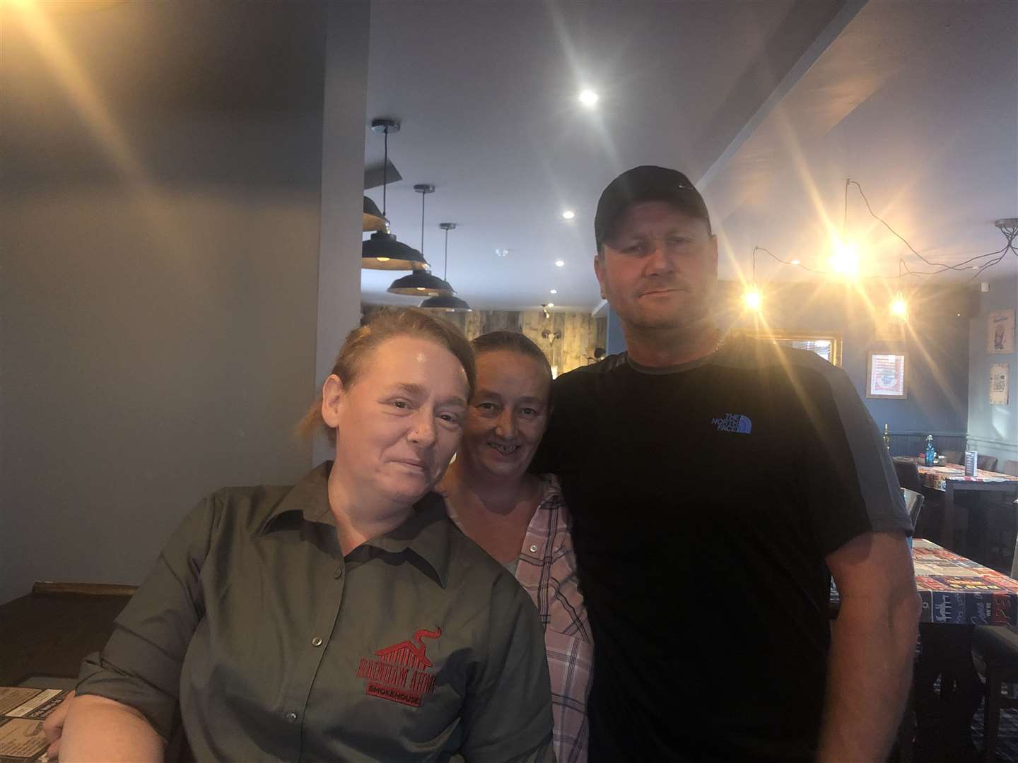 From left: Bar staff Zoe Clayden, landlady Marian Strelley and pub regular Paul