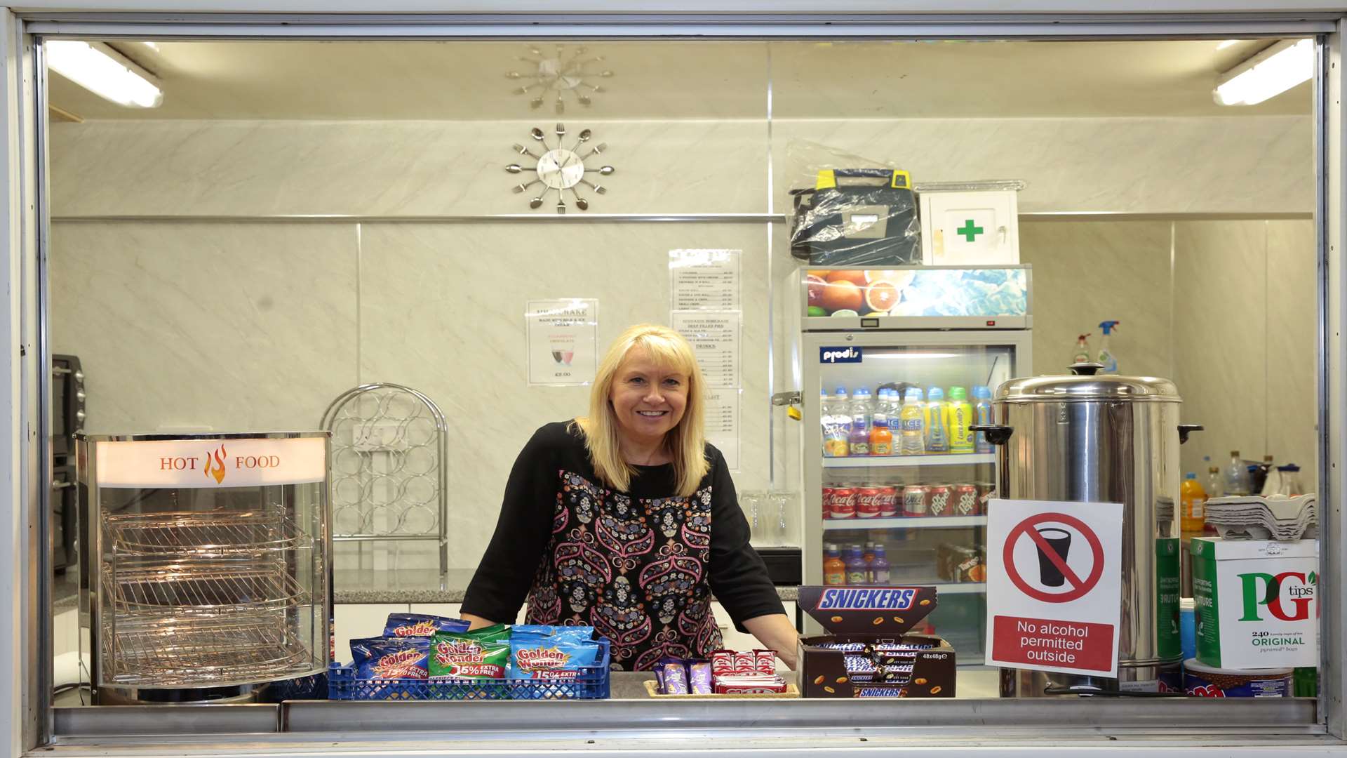 Facilities Manager Lesley Stevens behind the bar.