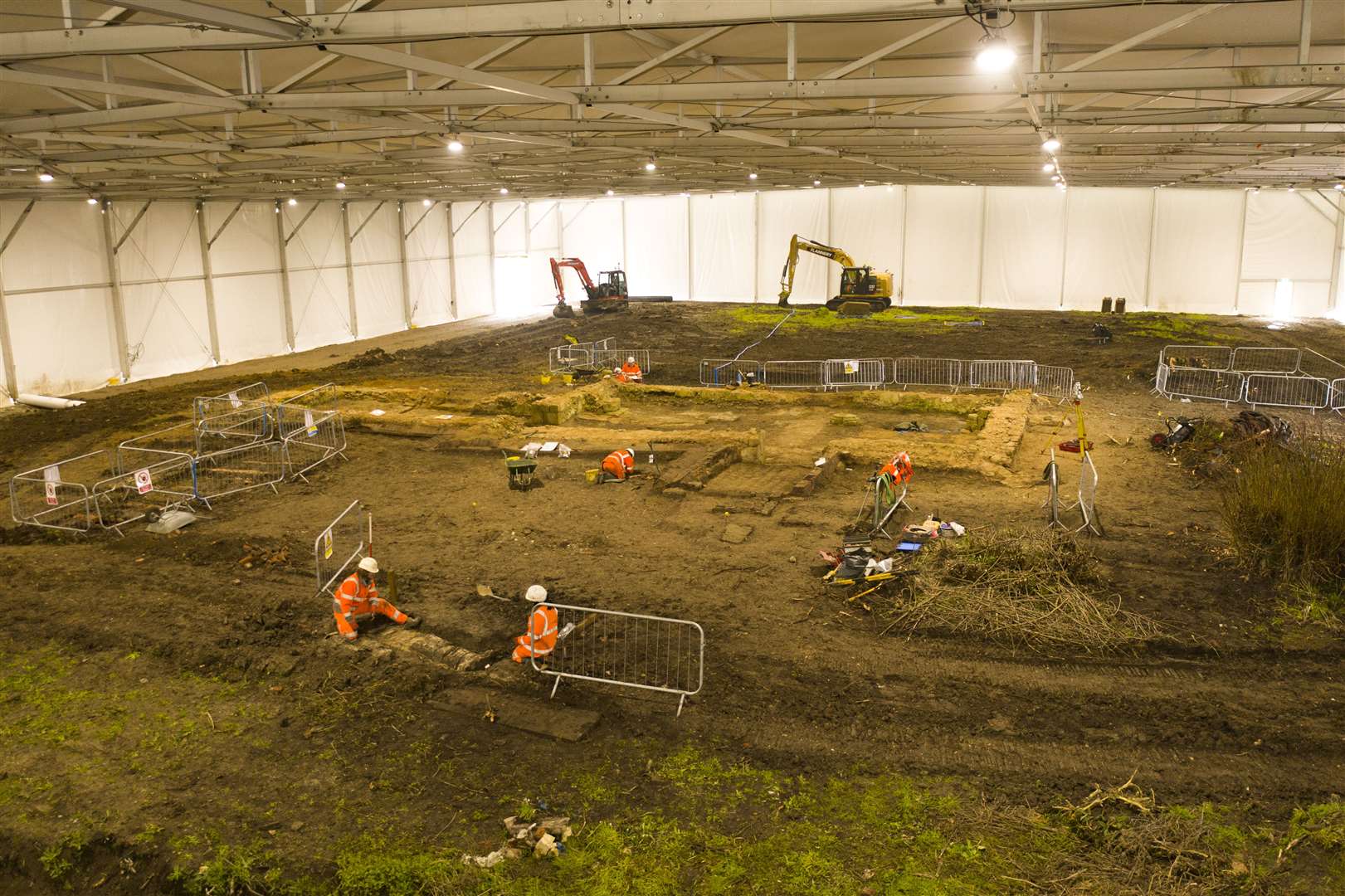 Archaeologists at work on the site of St Mary’s Church which lies in the path of the HS2 line (HS2 Ltd/ PA)