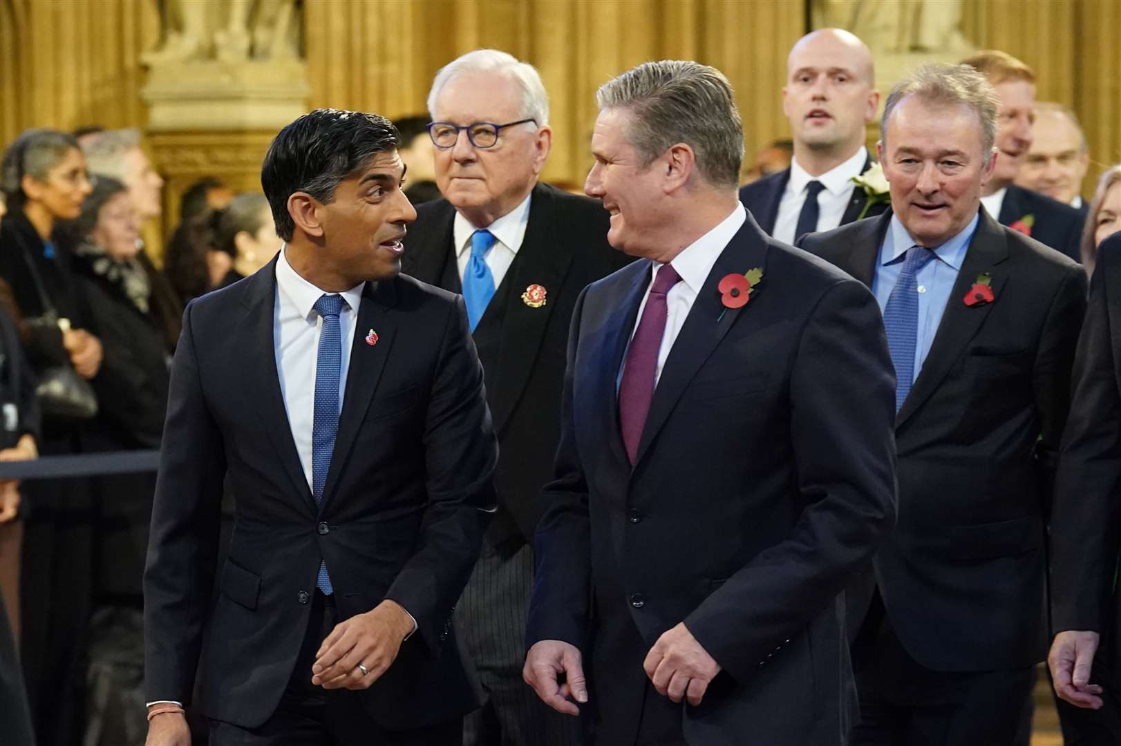 Prime Minister Rishi Sunak and Labour Party leader Sir Keir Starmer walk through the Central Lobby at the Palace of Westminster ahead of the state opening of Parliament in the House of Lords (Stefan Rousseau/PA)