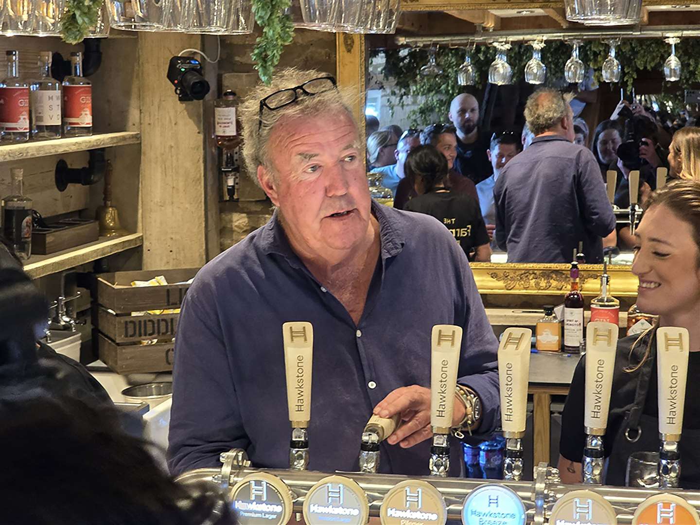 Jeremy Clarkson’s behind the bar of The Farmer’s Dog (Neil Robinson/PA)