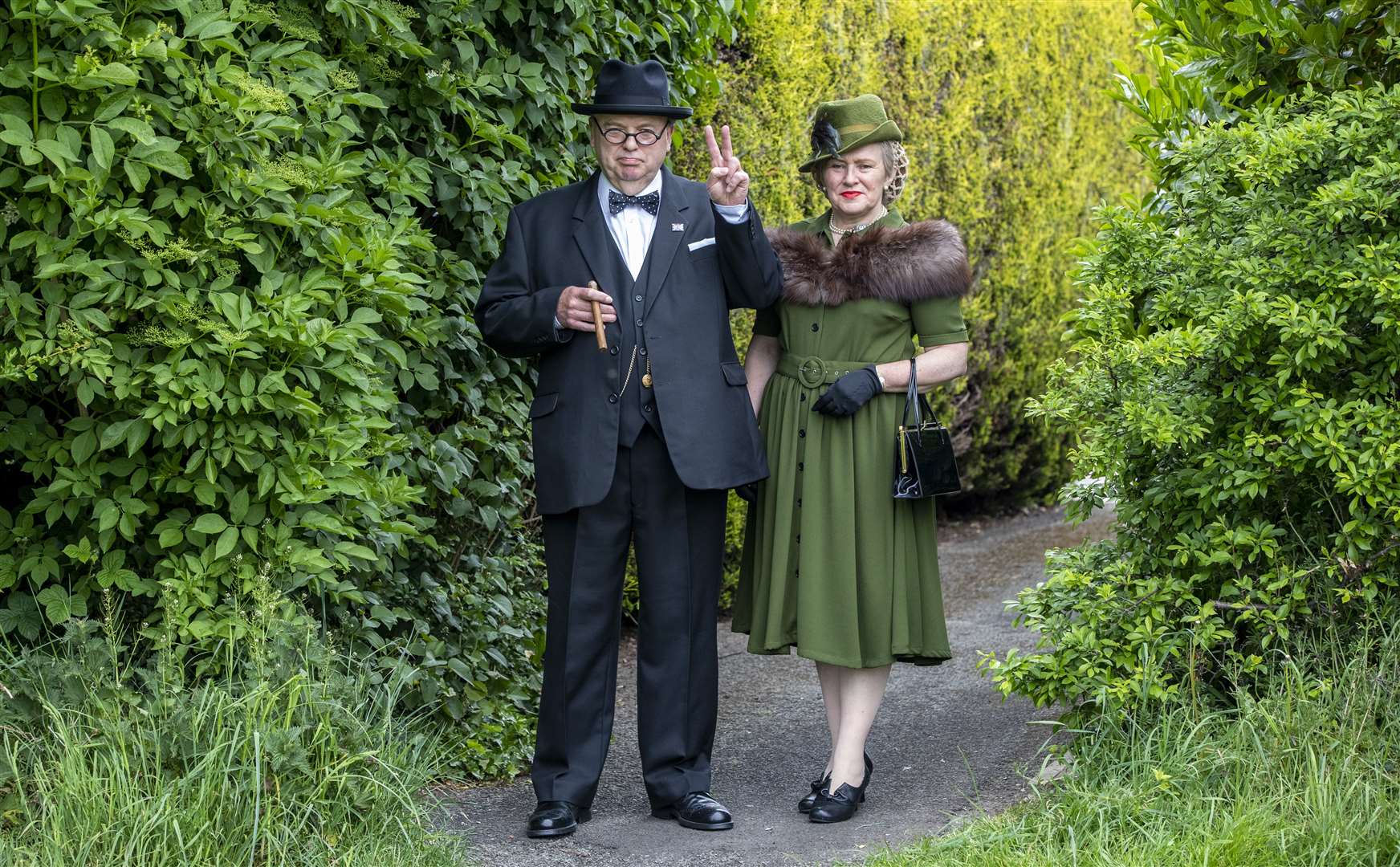 Derek Herbert, a Sir Winston Churchill impersonator from Little Neston, Wirral is dressed up to mark the 75th anniversary of VE Day with his wife Linda who is dressed as Clementine Churchill (Peter Byrne/PA)