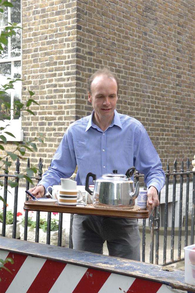 Will Palin brings refreshment to the team involved in the removal of the weather vane from the tower of St Paul's Dockyard Church