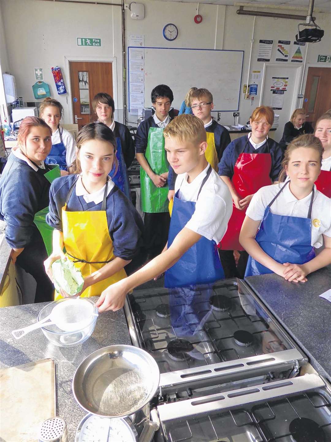 2013 Kent Cooks finalist, Amelia Murton, 15, shows Blaze Robson-Davis, 14, and home economics students from Castle Community College one of the dishes she is planning to create for the 2014 competition.