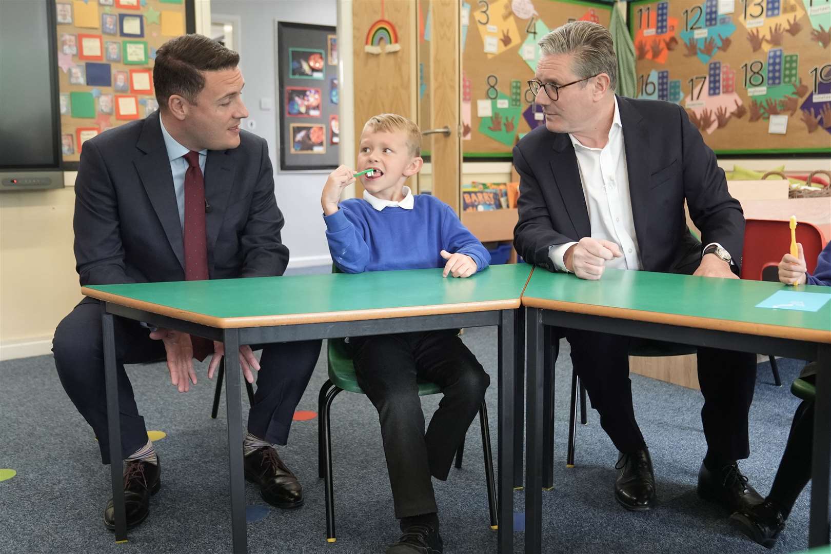 Sir Keir and shadow health secretary Wes Streeting (left) met future voters when they visited Whale Hill Primary School in Eston (Stefan Rousseau/PA)