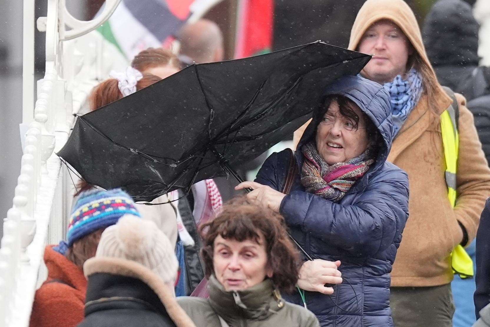 Snow, rain and wind warnings are in force and are expected to cause travel issues on New Year’s Eve (Niall Carson/PA)