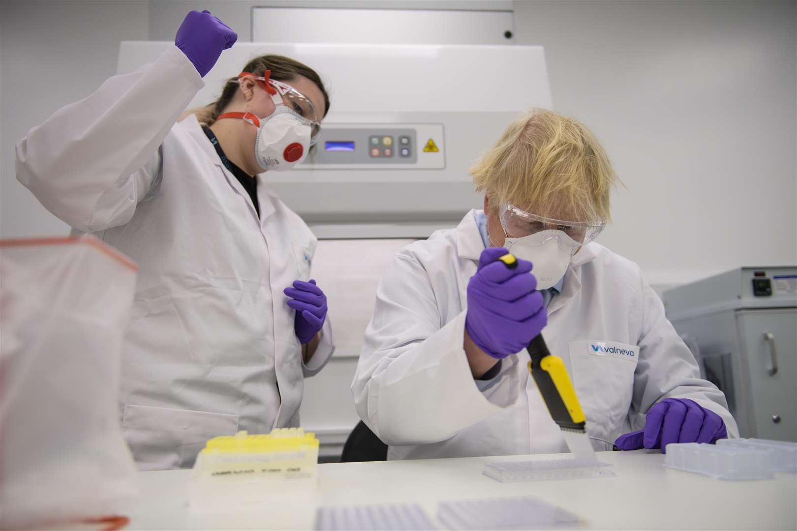 Prime Minister Boris Johnson with quality control technician Kerri Symington as he visits the French biotechnology laboratory Valneva in Livingston in January (Wattie Cheung/Daily Mail/PA)