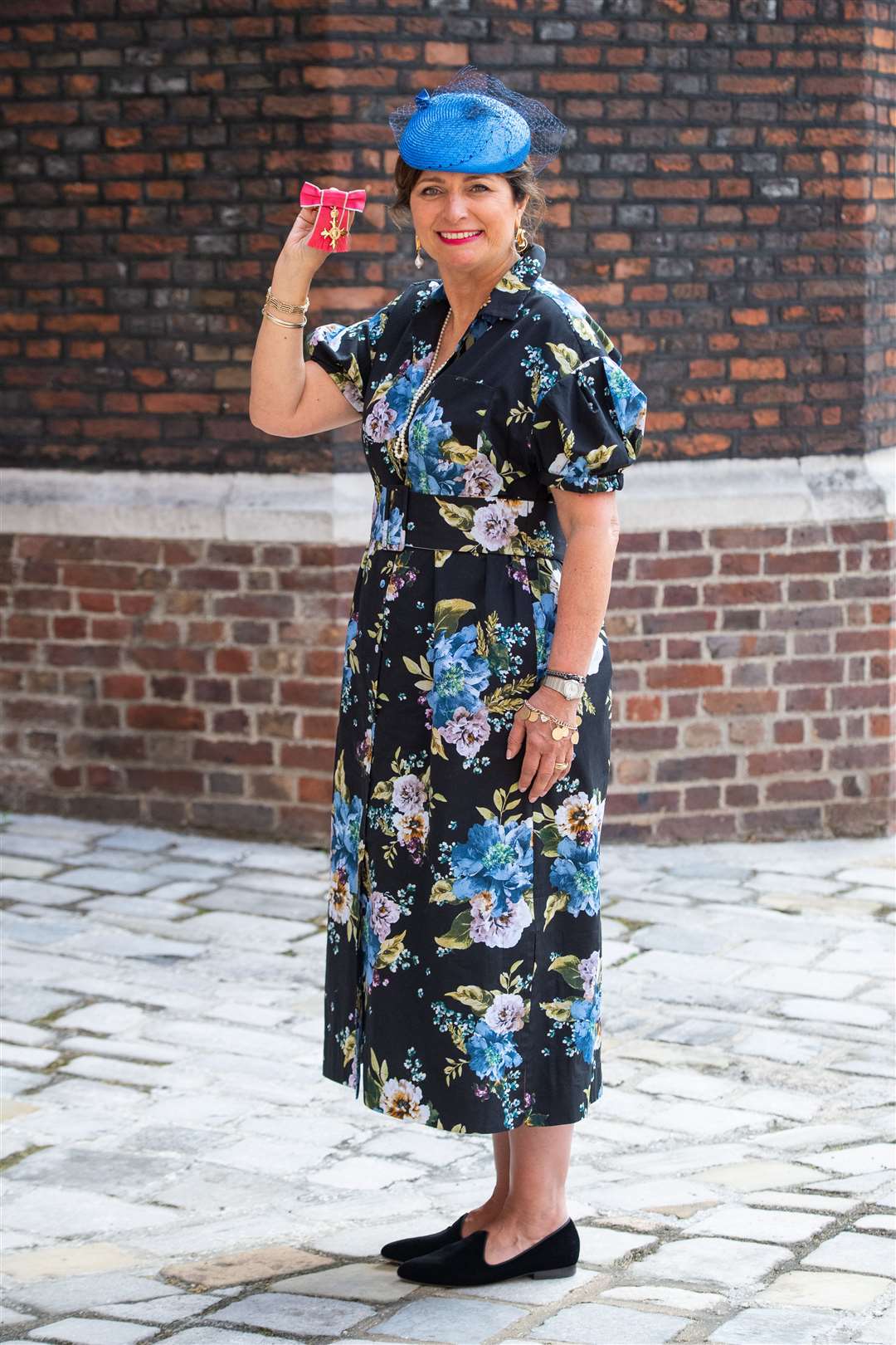 Allison Ogden-Newton with her OBE medal, following an investiture ceremony at St James’s Palace, London (Dominic Lipinski/PA).