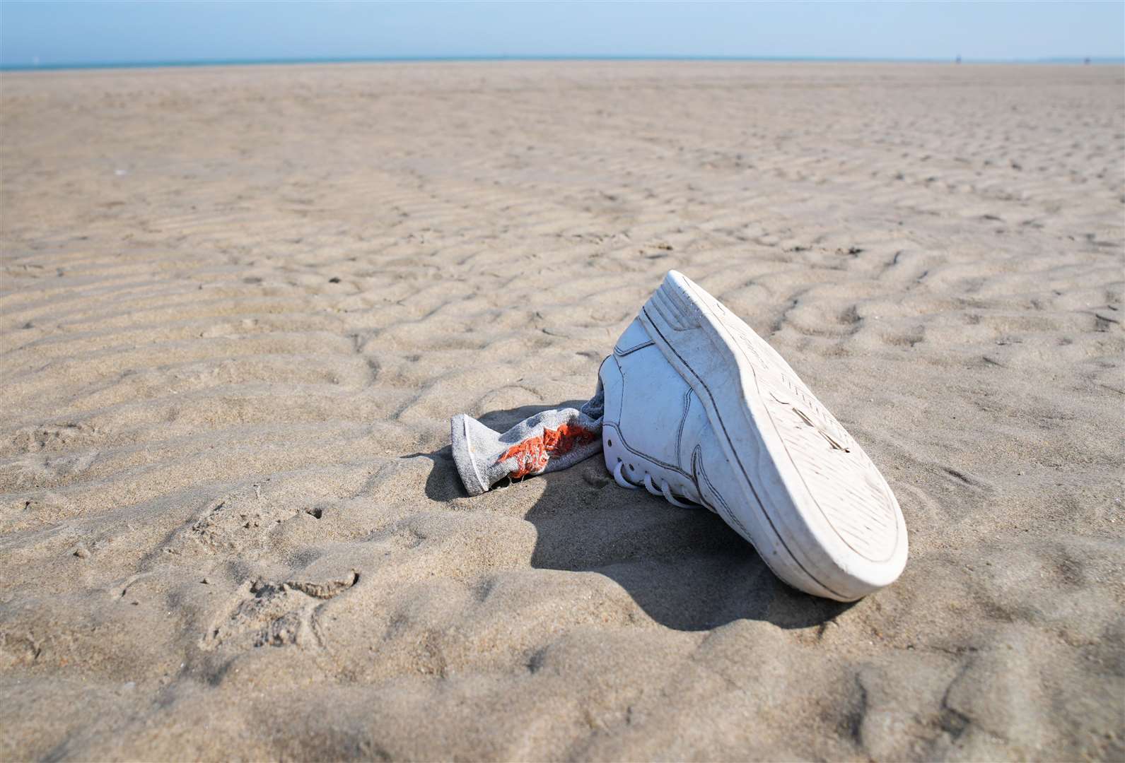 Belongings of people thought to be migrants are left on the beach in Gravelines, France (Gareth Fuller/PA)