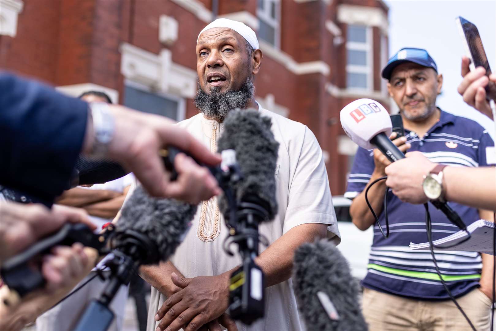 Imam Sheik Ibrahim Hussein, speaks to media outside Southport Islamic Centre Mosque (James Speakman)