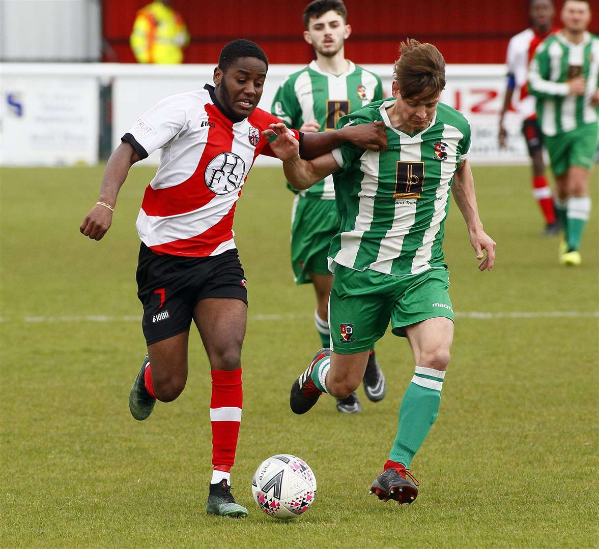 Tarik Ibrahim fends off his marker during his time at Sheppey United. Picture: Sean Aidan