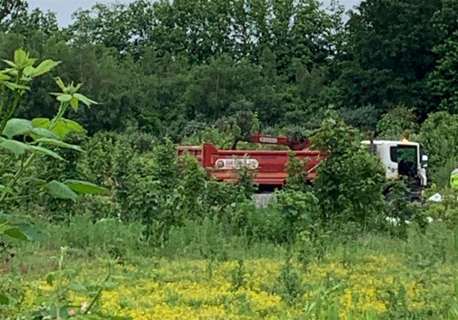 A truck helping move the caravans and mobile homes onto the site